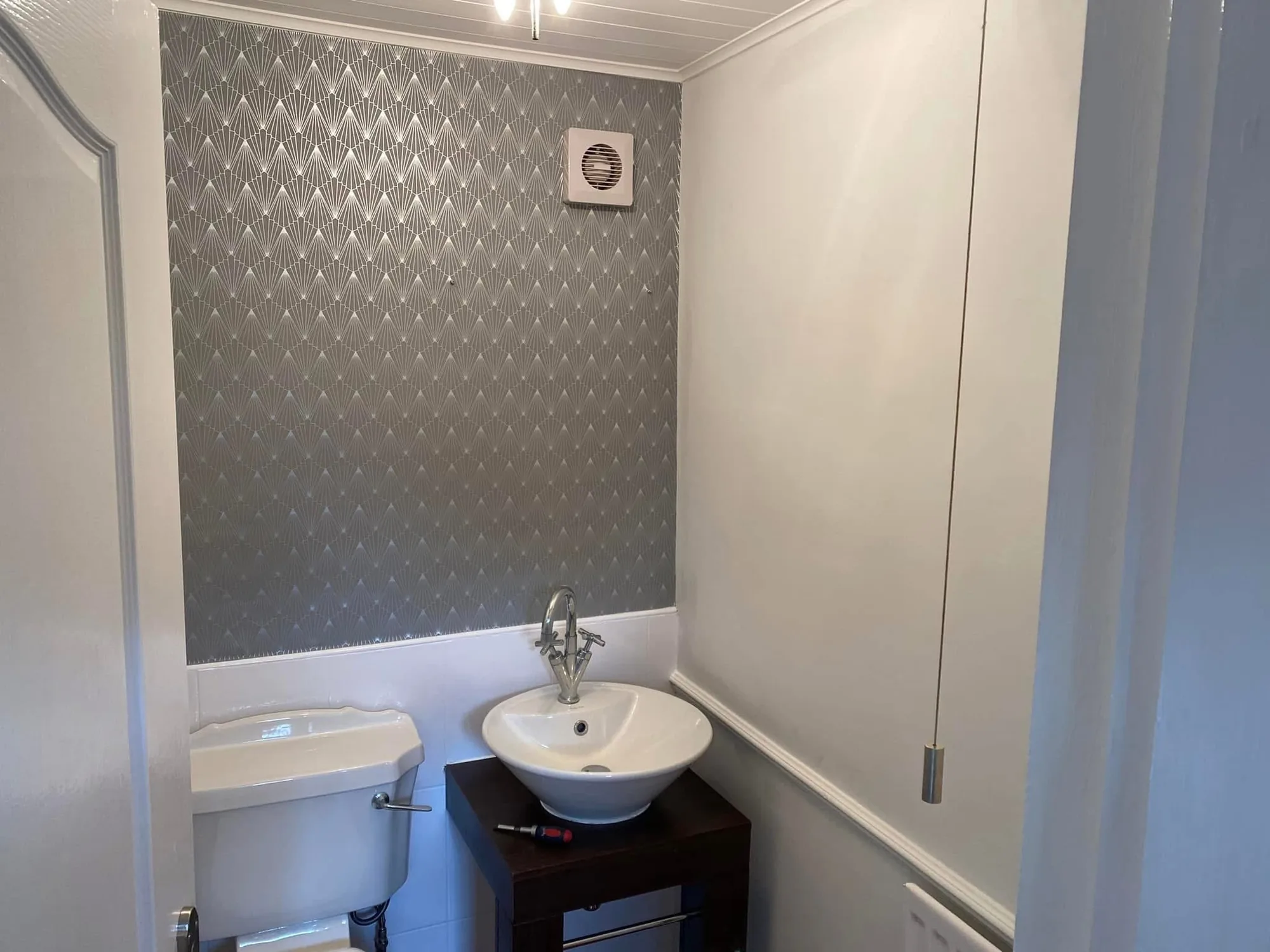 Cloakroom wallpapering before & after after