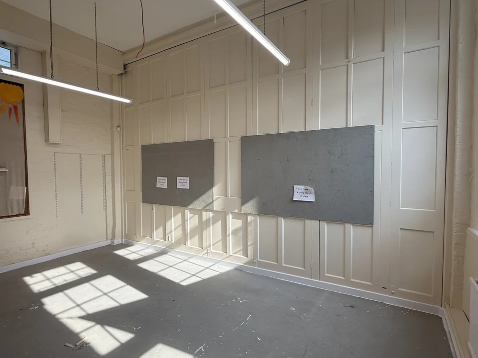 Repainted classroom panelling around retained display boards at Stapeley school in Nantwich
