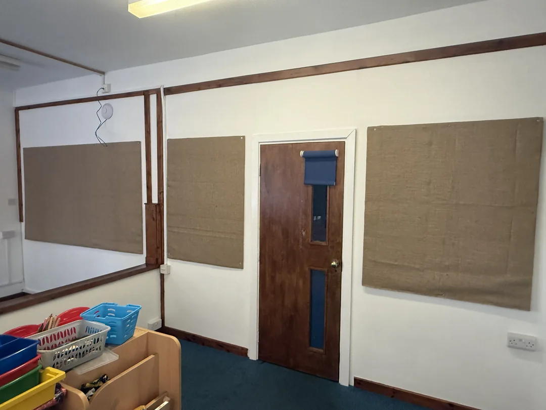 Finished classroom walls around the retained display boards and timber door at Darnhall school
