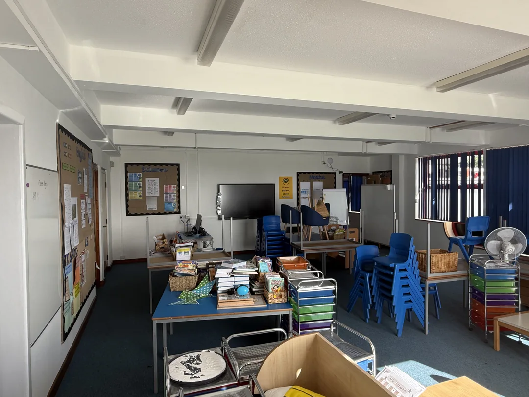 Completed walls and ceiling around the retained teaching displays.
