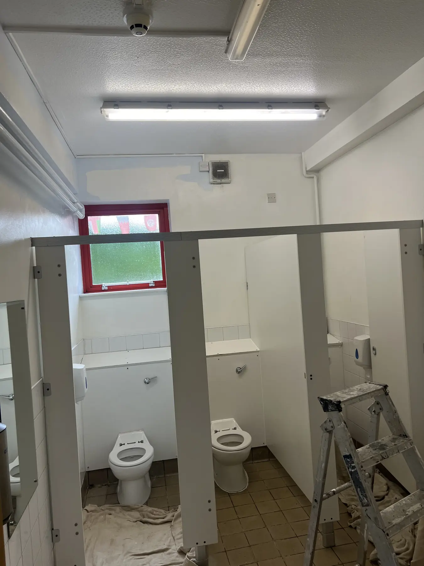 Darnhall school bathroom partitions during preparation