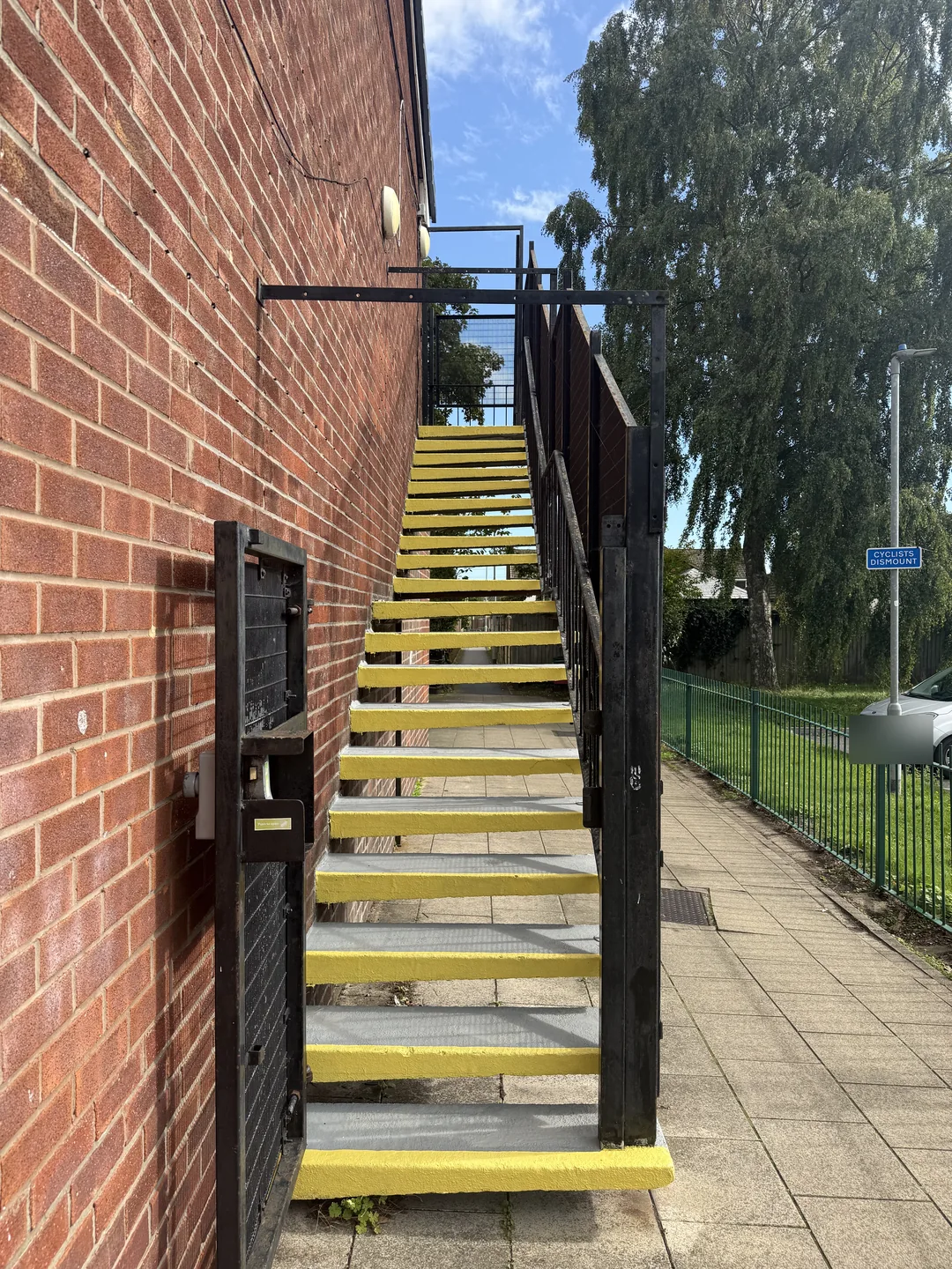 Second external staircase after redecoration, with yellow nosings.
