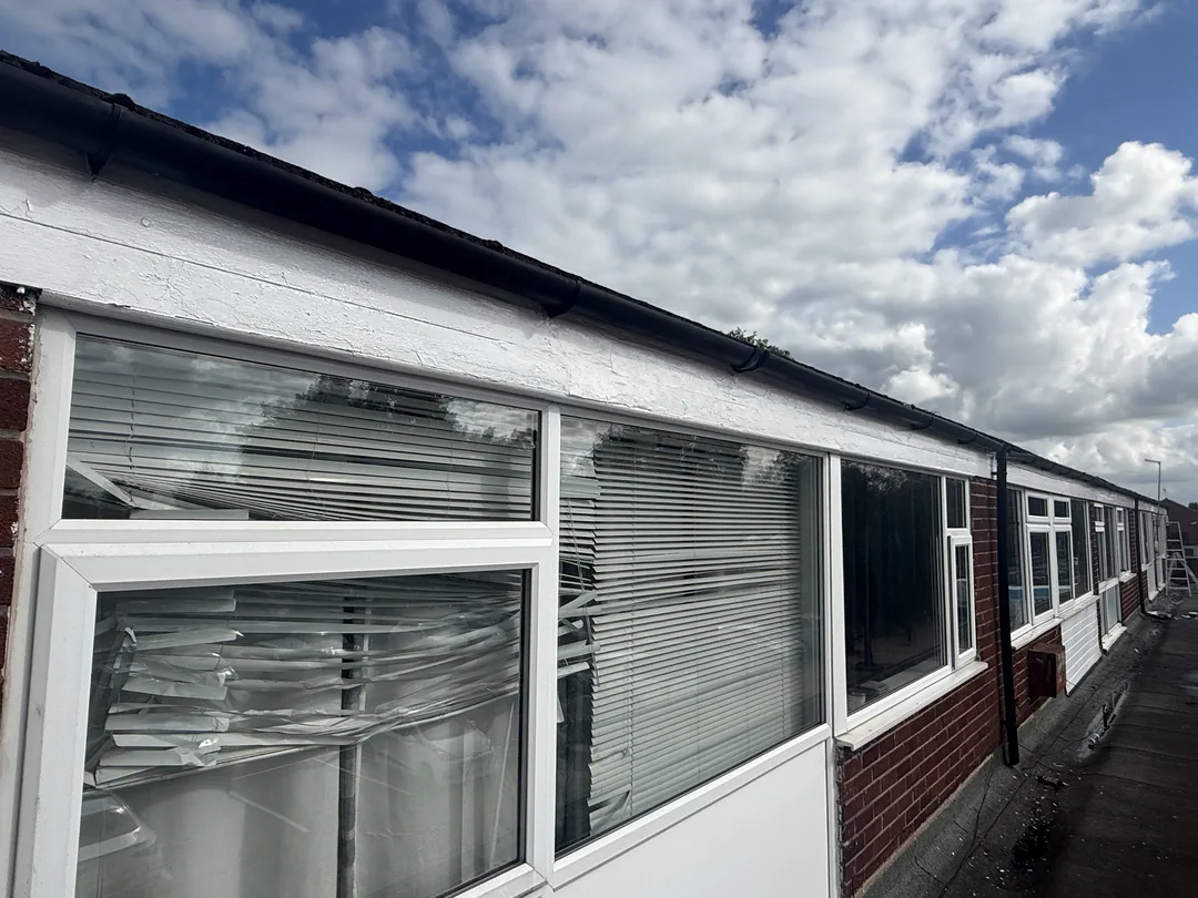 Upper fascia and window surround after redecoration.