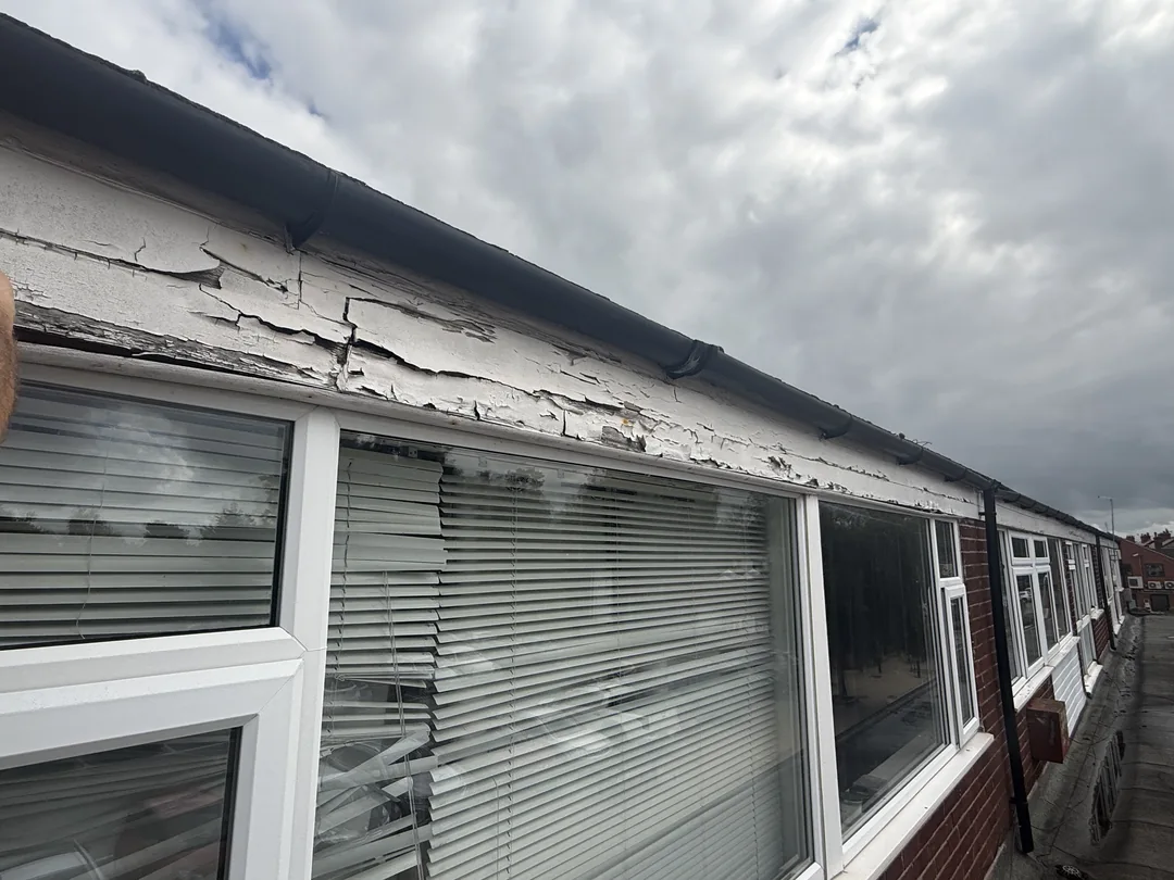 Upper fascia and window surround before redecoration.