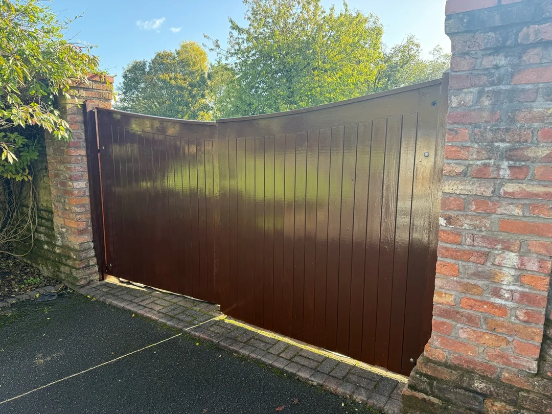 The completed brown finish across the front of the pair of driveway gates in Lach Dennis.