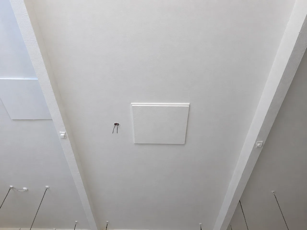 School ceiling around the access panel after white repainting