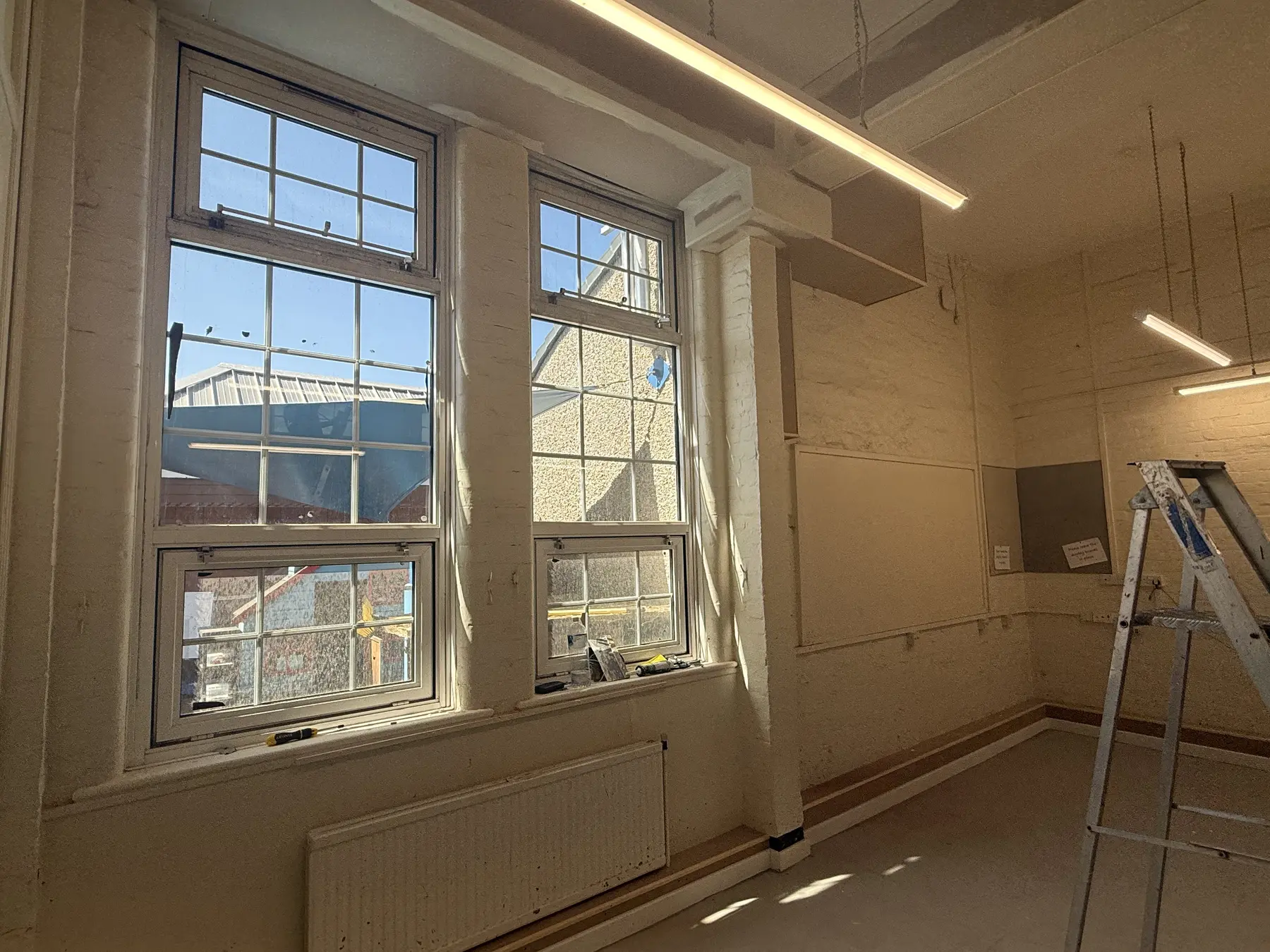 Classroom one window wall before final painting