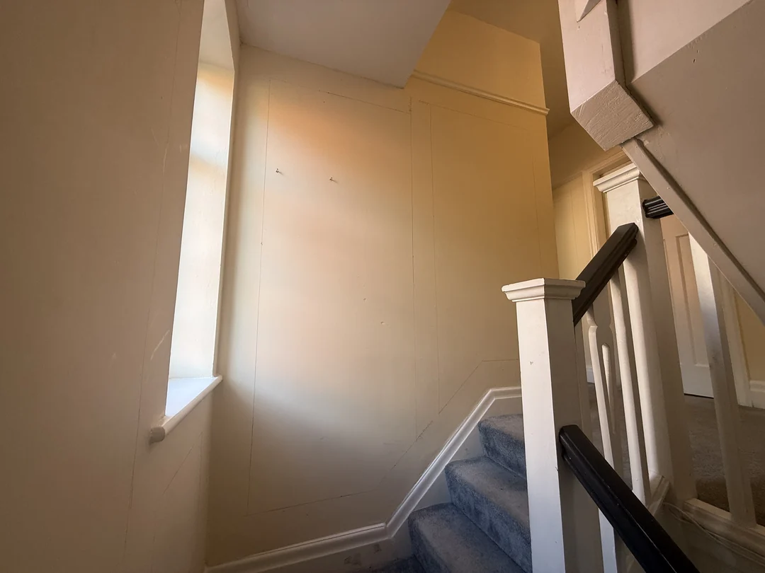 The wall beside the stairwell window before the new beading.
