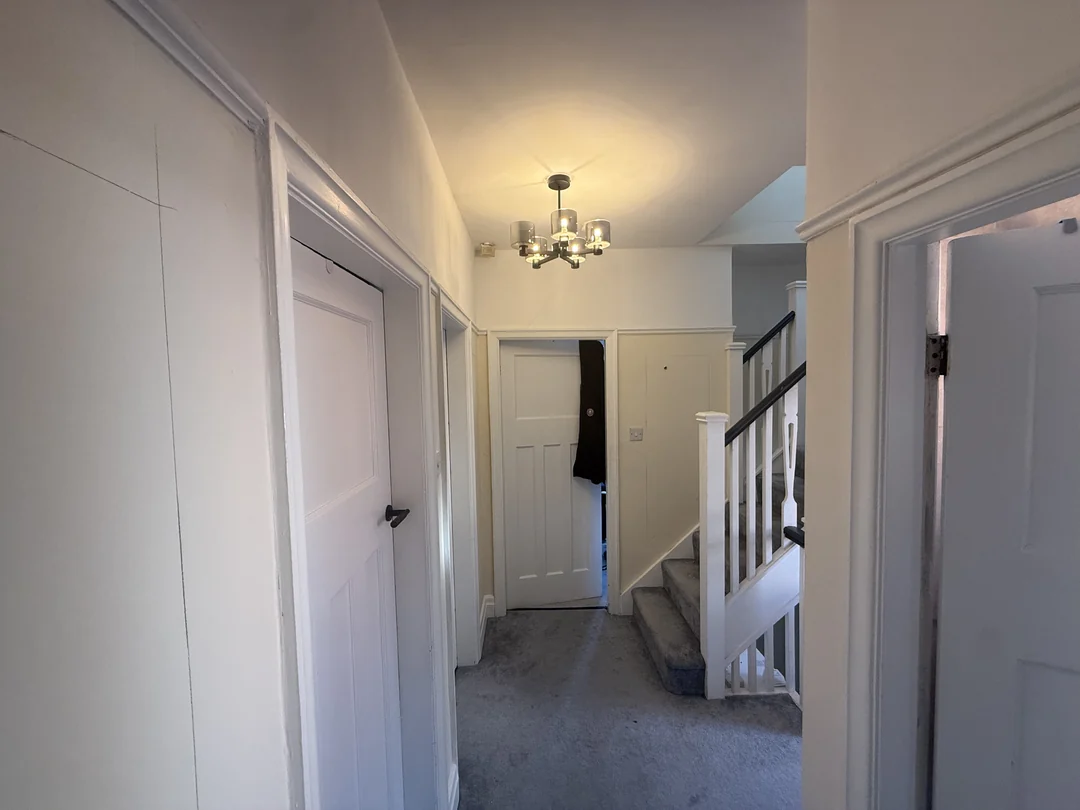 A view along the landing before the new wall beading and decorating.
