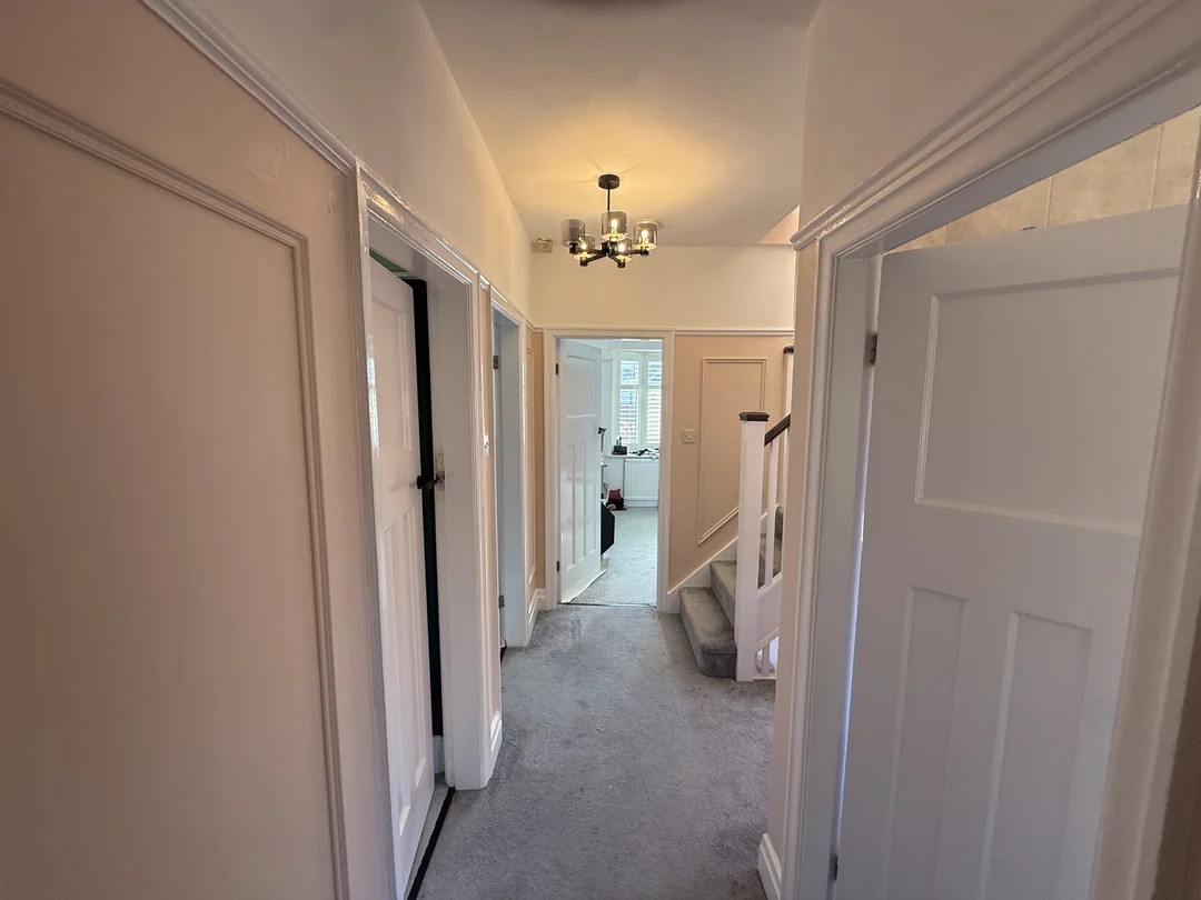 The completed landing with painted wall panels continuing along the corridor.