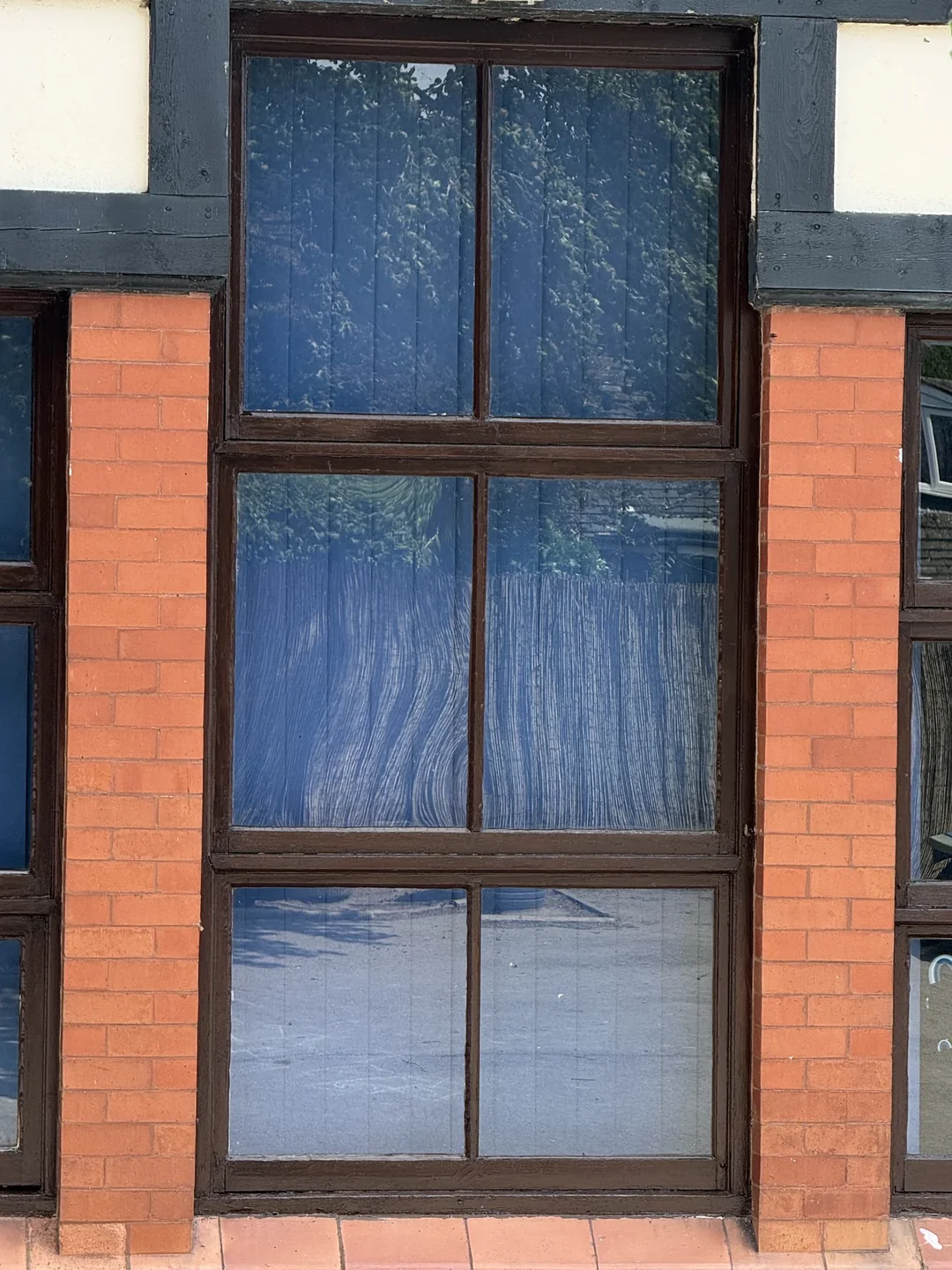 After decoration: a tall timber window.