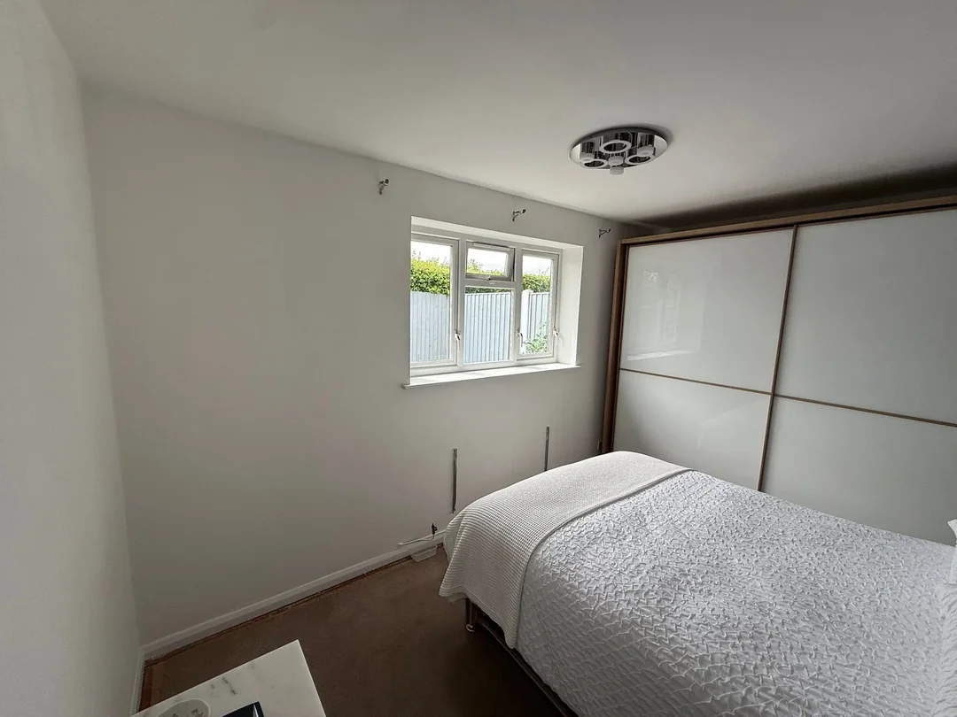 The surrounding walls with their new plain painted finish.