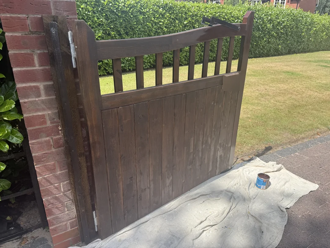 The timber gate before its renewed finish.