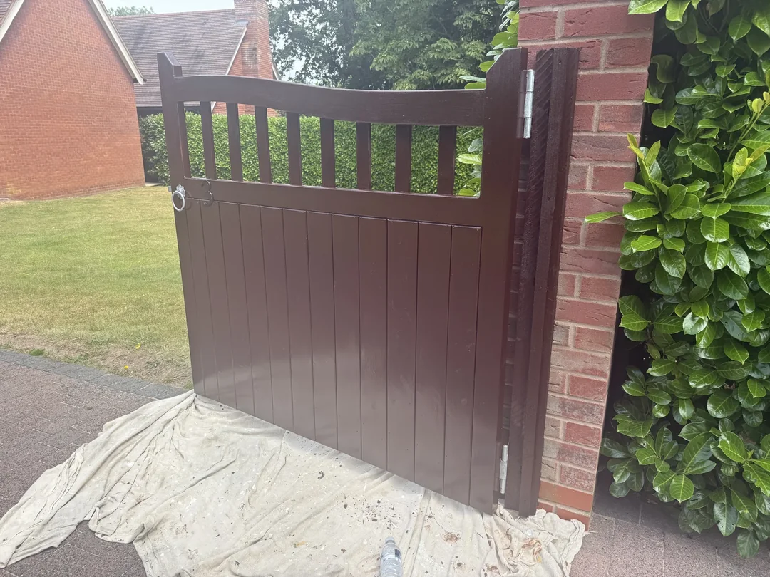 The finished reverse face of the gate, with the paving still protected.