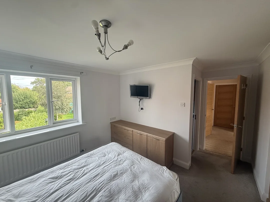 The finished bedroom from the opposite side of the room.