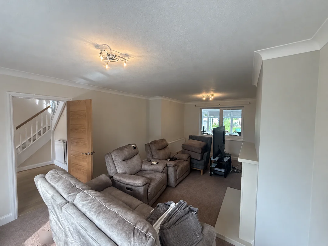 The decorated living room, looking towards the adjoining space.