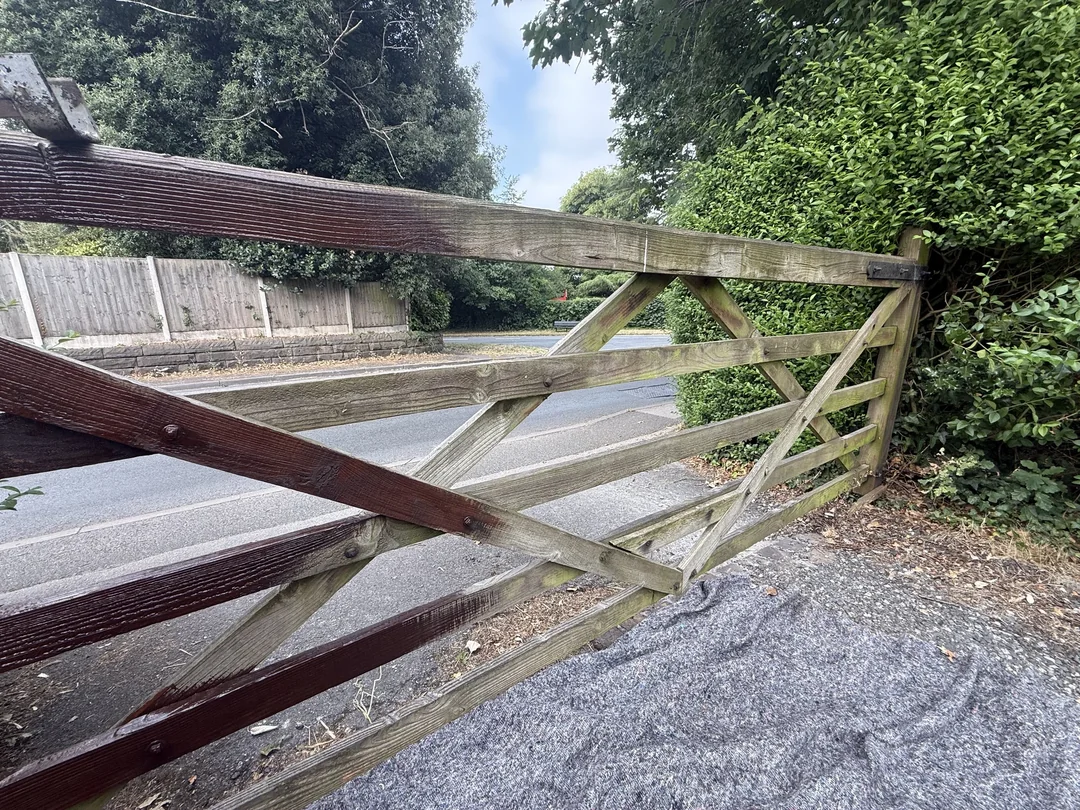 The gate during the change from its weathered appearance.